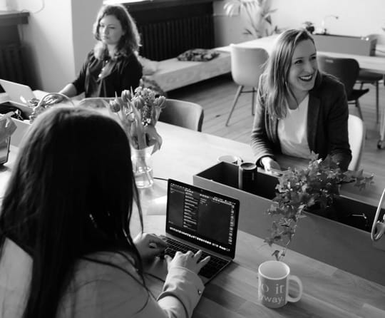 A group of people working at a table