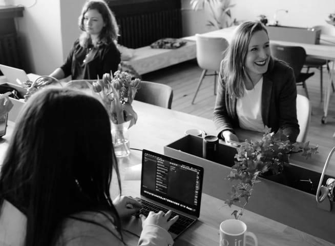 A group of people working at a table